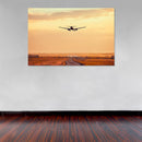 Cuadro Decorativo Avión aterrizando en atardecer