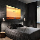 Cuadro Decorativo Avión aterrizando en atardecer